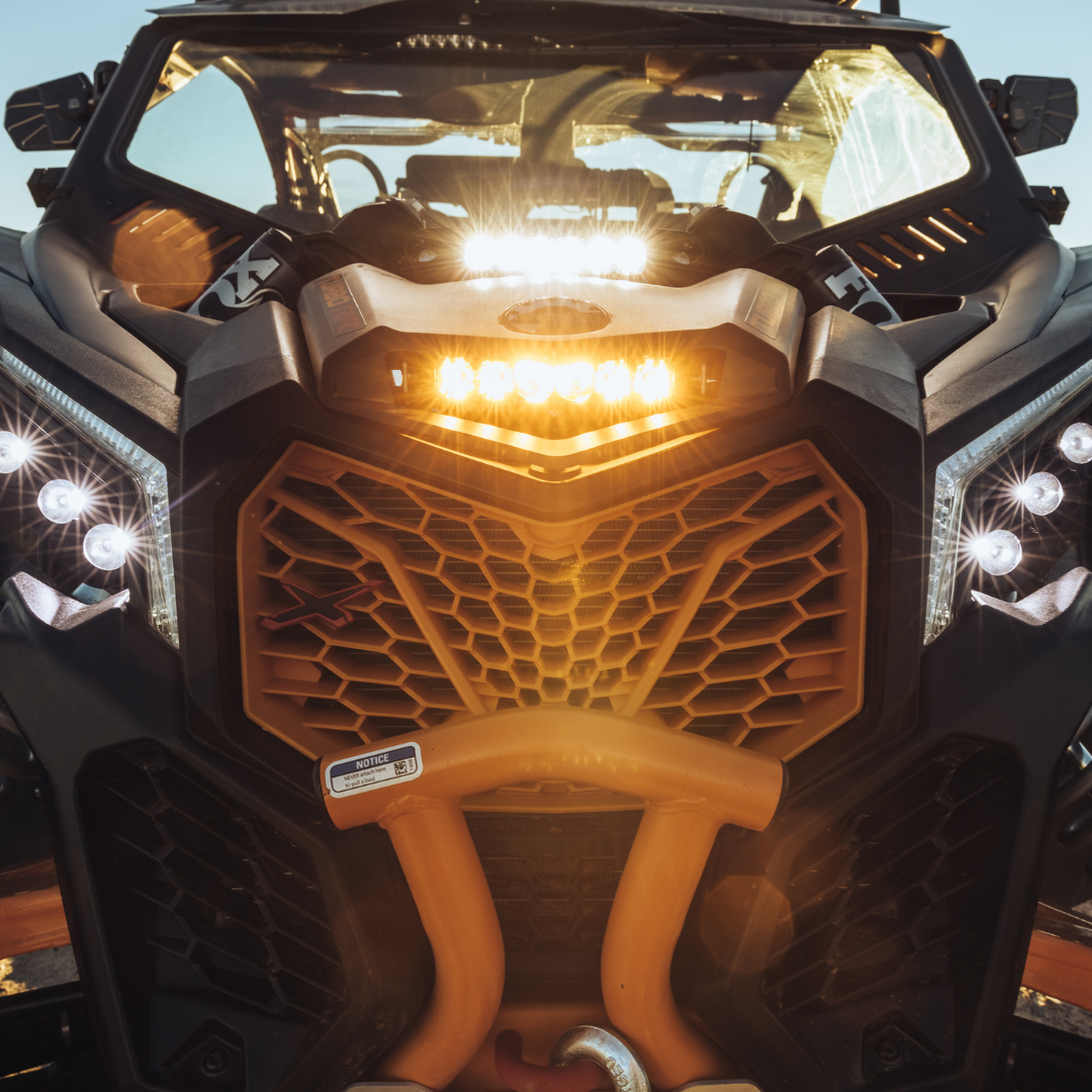 6 inch amber led light bar mounted as a shock tower light on a can-am maverick 