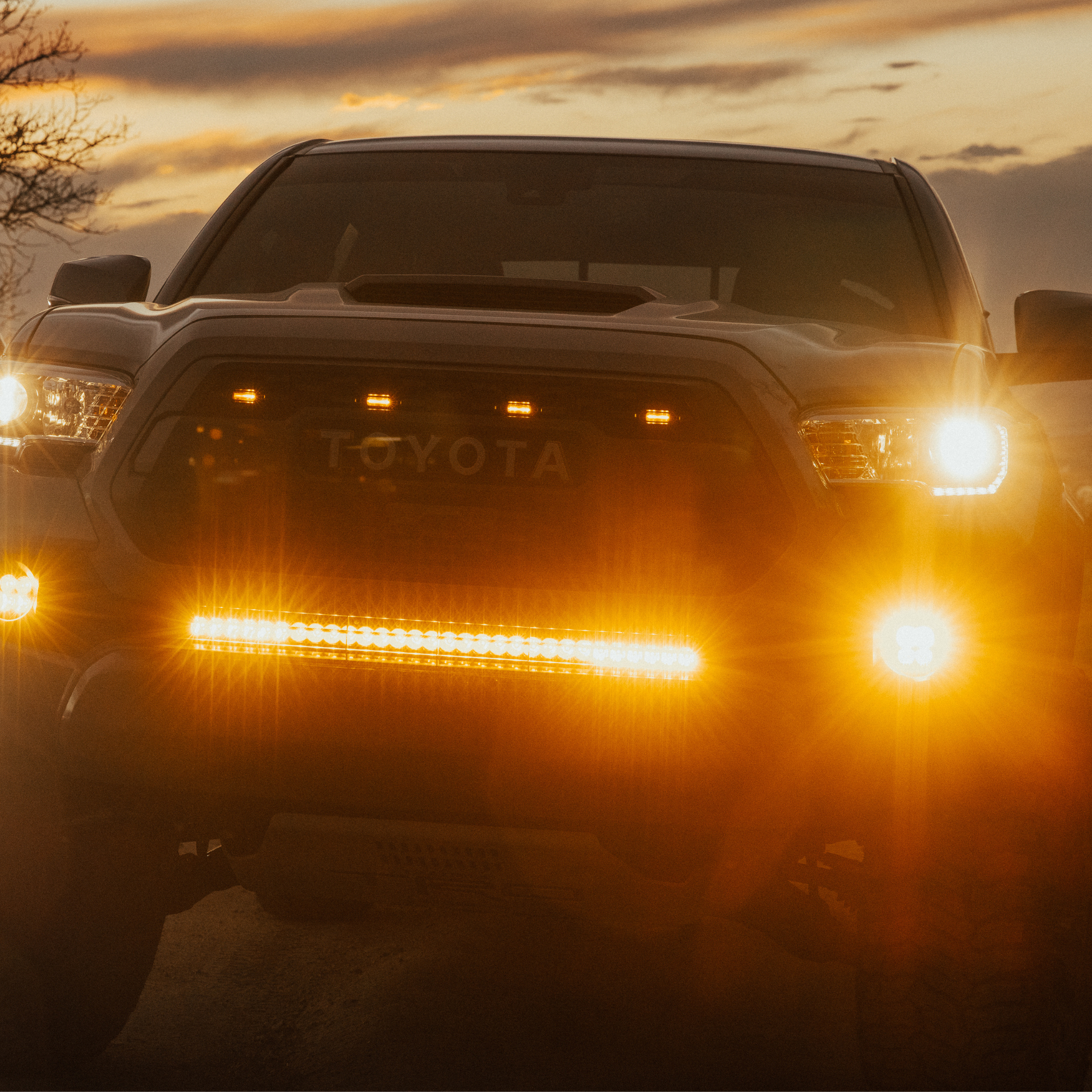 amber LED behind the grille light bar mounted on a toyota tacoma
